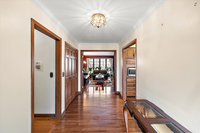 corridor featuring crown molding and dark wood-type flooring