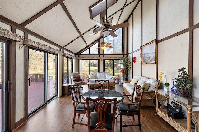 sunroom / solarium featuring ceiling fan and lofted ceiling