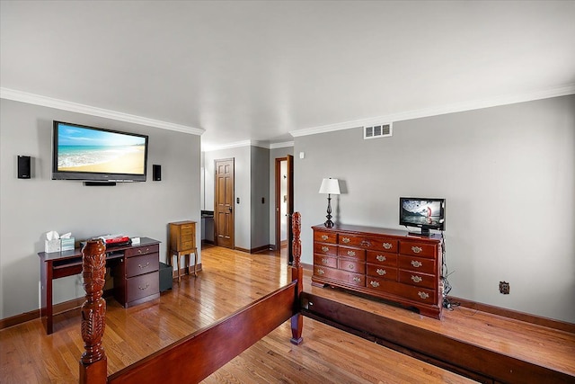 bedroom featuring light hardwood / wood-style flooring and ornamental molding