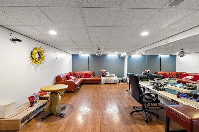 office featuring a drop ceiling and wood-type flooring