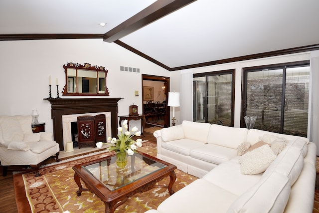 living room featuring hardwood / wood-style flooring, ornamental molding, and vaulted ceiling with beams