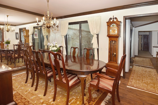 dining area with a notable chandelier, hardwood / wood-style flooring, and ornamental molding