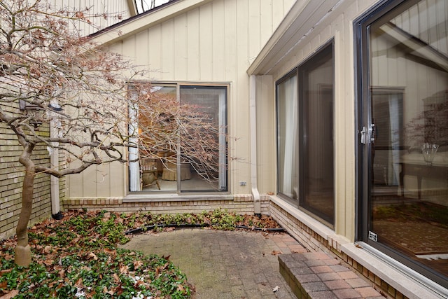 entrance to property with a patio area