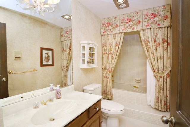 full bathroom featuring toilet, vanity, and shower / bath combo with shower curtain