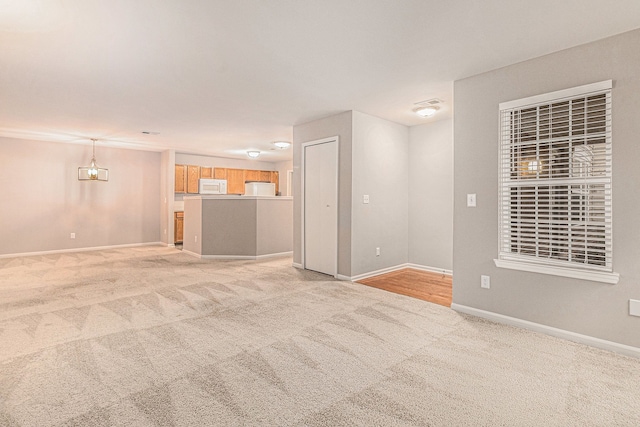 spare room with light colored carpet