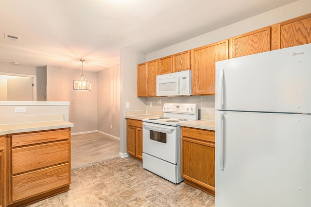 kitchen featuring white appliances, decorative light fixtures, and a notable chandelier