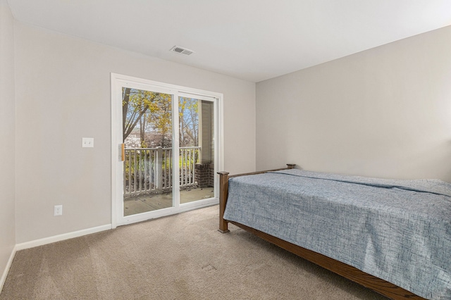 carpeted bedroom featuring access to exterior