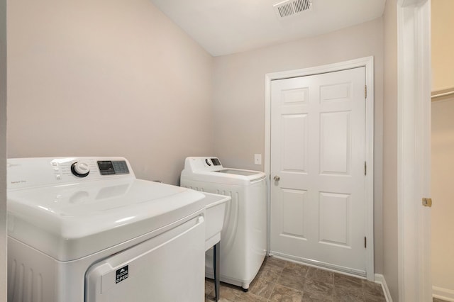 laundry area with washer and clothes dryer