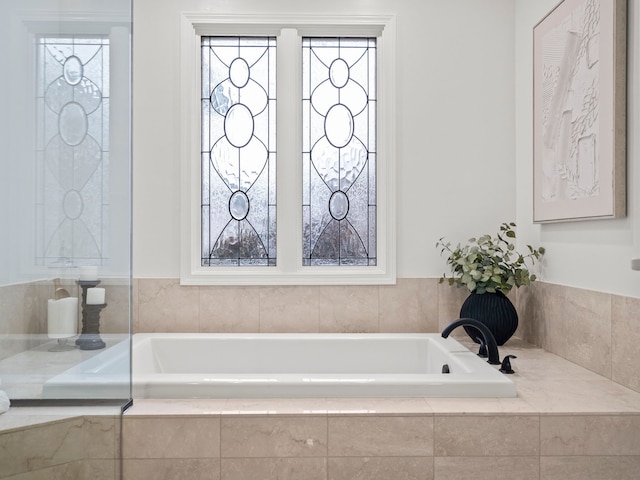 bathroom with tiled tub