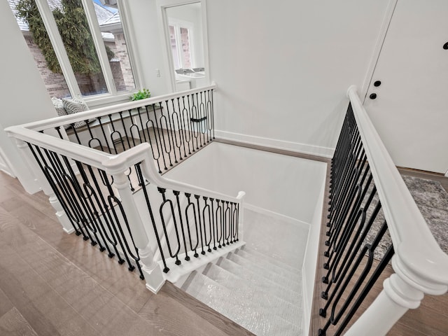 staircase featuring hardwood / wood-style floors