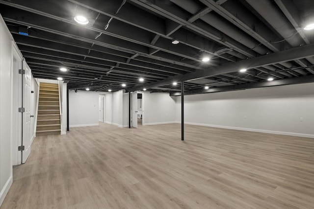 basement featuring light hardwood / wood-style floors