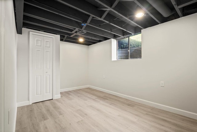 basement featuring light wood-type flooring