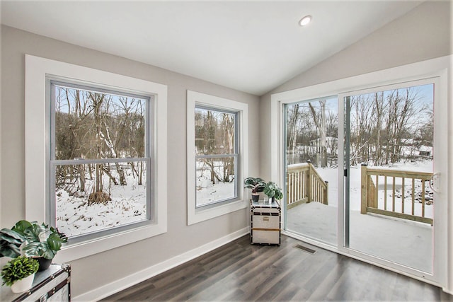 sunroom / solarium with lofted ceiling and a wealth of natural light