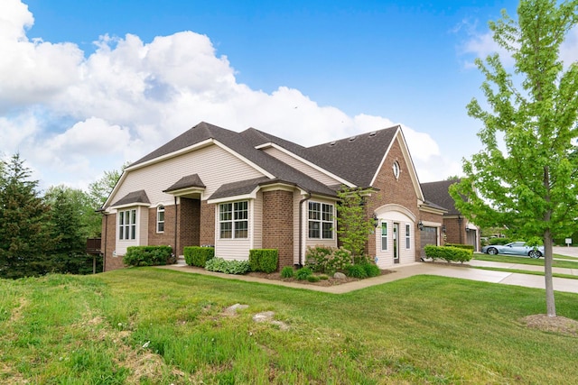 view of front of house featuring a front lawn and a garage