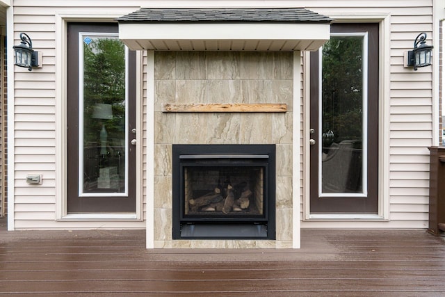 exterior details with a tile fireplace