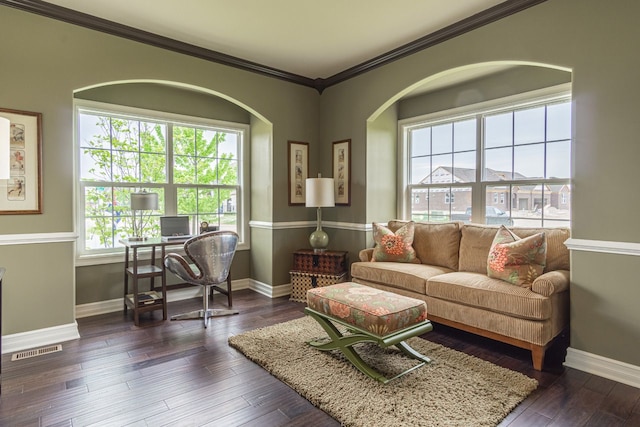 living room with dark hardwood / wood-style flooring and crown molding