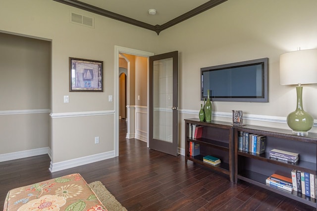 bedroom featuring french doors, crown molding, and dark hardwood / wood-style flooring