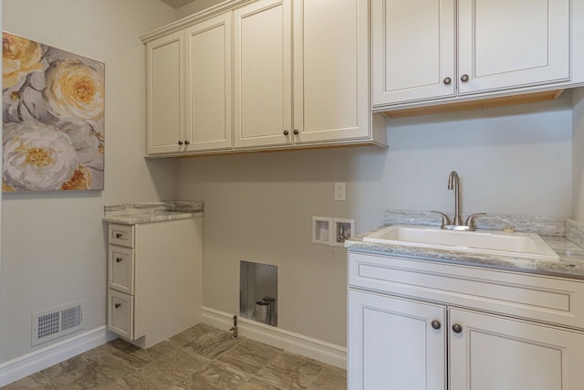 laundry area featuring sink, cabinets, and hookup for a washing machine