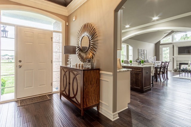 foyer featuring dark hardwood / wood-style flooring and crown molding