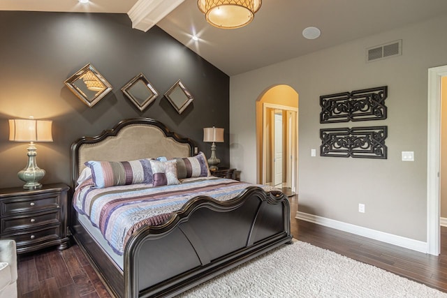 bedroom featuring lofted ceiling with beams and dark hardwood / wood-style floors