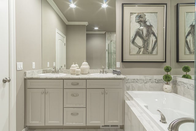 bathroom featuring vanity, ornamental molding, and independent shower and bath