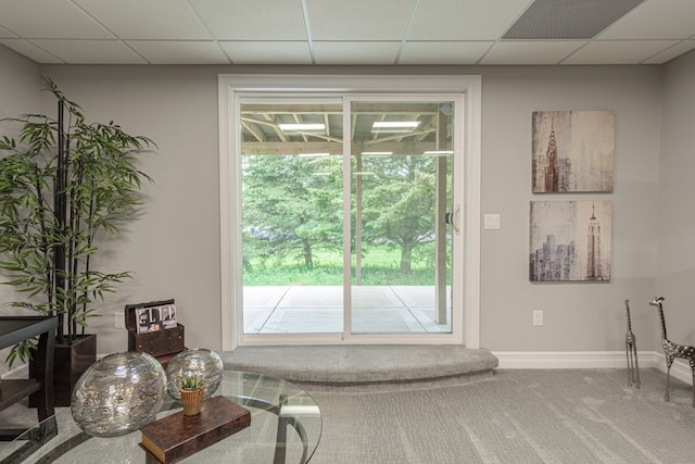 doorway to outside featuring carpet flooring