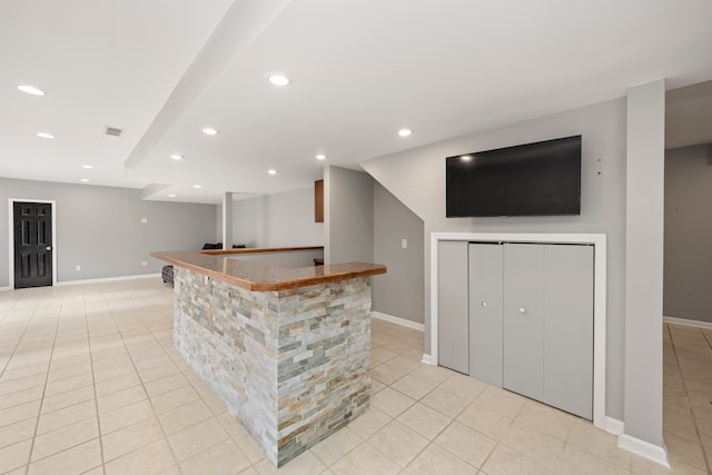 bar with light tile patterned floors