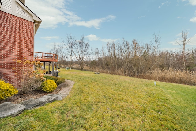 view of yard with a wooden deck