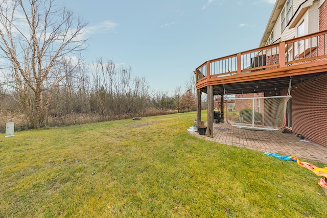 view of yard with a deck and a patio