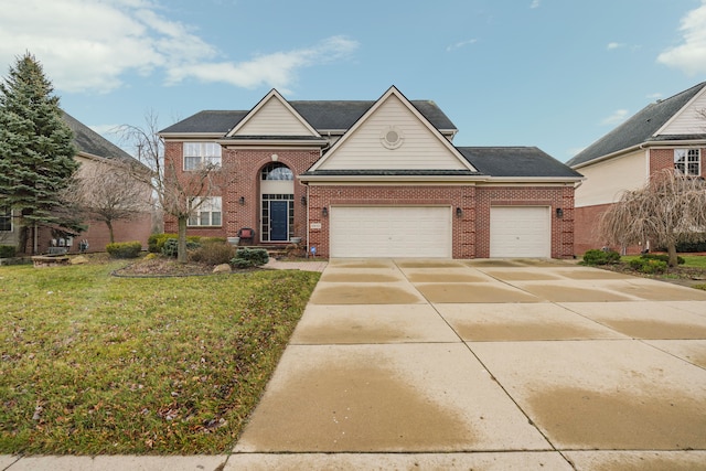 front of property with a front yard and a garage