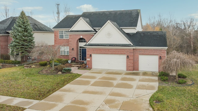 view of front facade featuring a garage and a front lawn