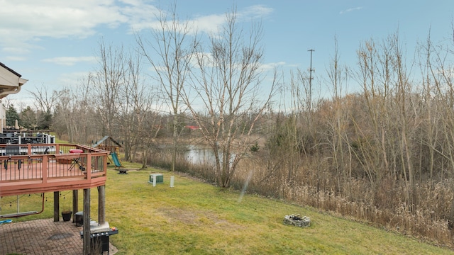 view of yard with a playground and a wooden deck