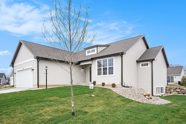 view of front of property with a garage and a front yard