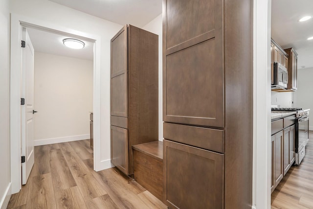 hallway featuring light wood-type flooring