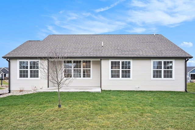 back of property featuring a lawn and a patio area