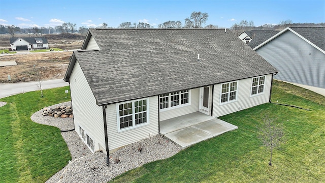 view of front of house featuring a front lawn and a patio area