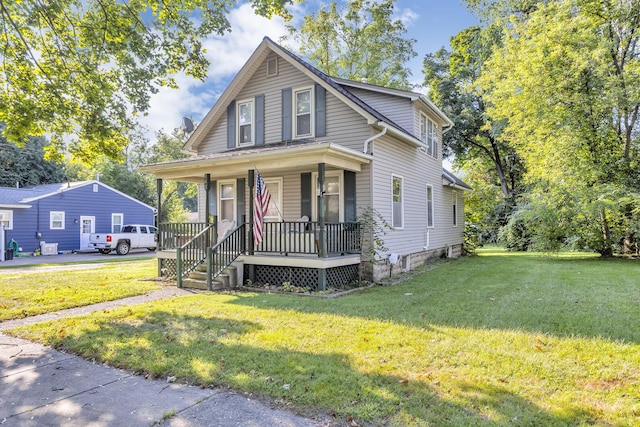 bungalow-style home with a front lawn and covered porch