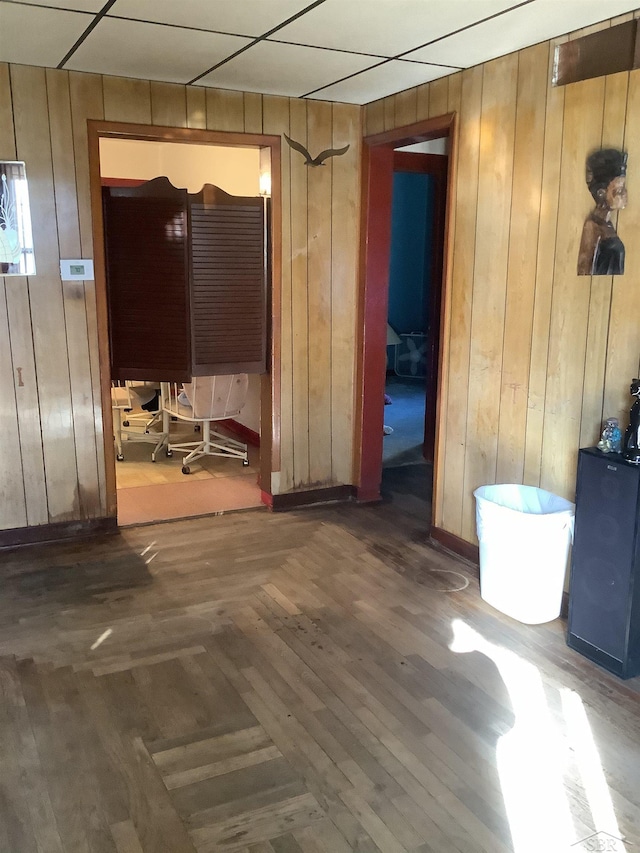 4135 Gallagher St, Saginaw, MI 48601 - empty room featuring wood walls and dark wood-type flooring