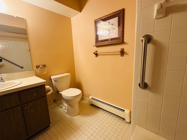 bathroom featuring baseboard heating, vanity, and toilet