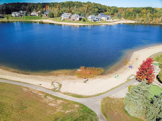 birds eye view of property featuring a water view