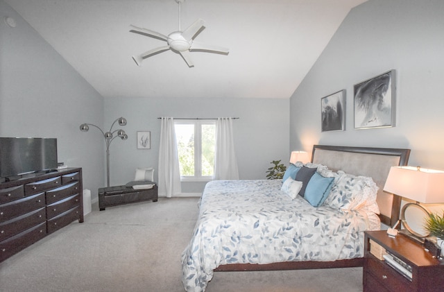 carpeted bedroom featuring ceiling fan and vaulted ceiling