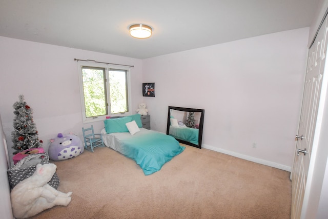 bedroom with light colored carpet