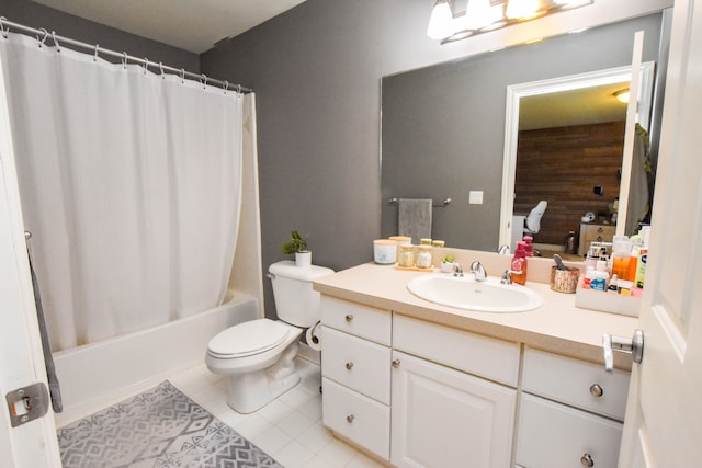 full bathroom with tile patterned floors, vanity, toilet, and shower / bath combo with shower curtain