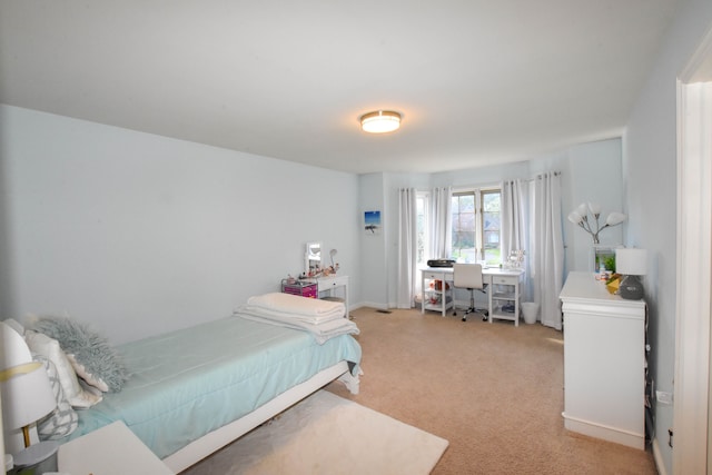 bedroom with light colored carpet