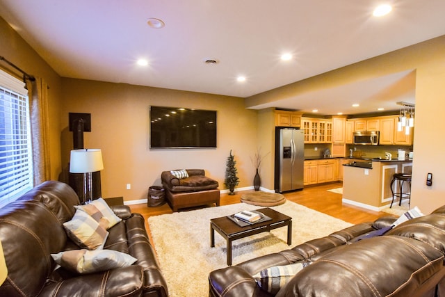 living room with light hardwood / wood-style floors