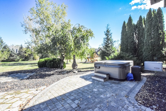 view of patio / terrace with a hot tub