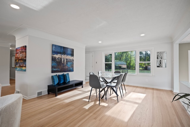 dining area featuring light wood-type flooring