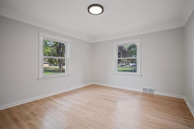 spare room with light wood-type flooring