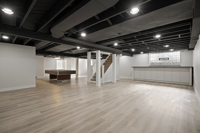 basement featuring wood-type flooring and pool table