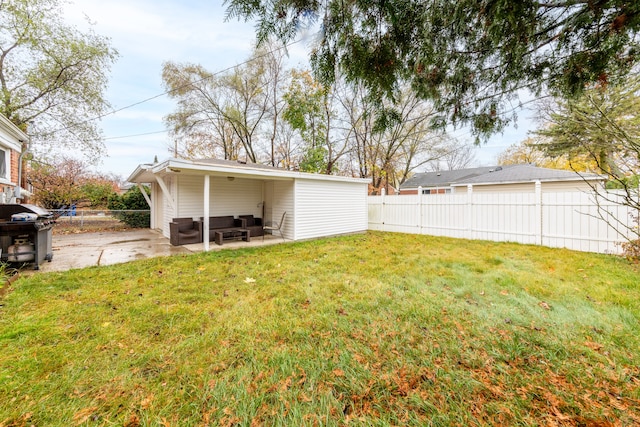 view of yard with an outdoor living space and a patio